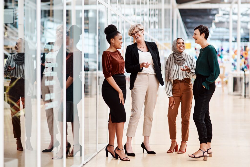 Diverse group of women talking at work
